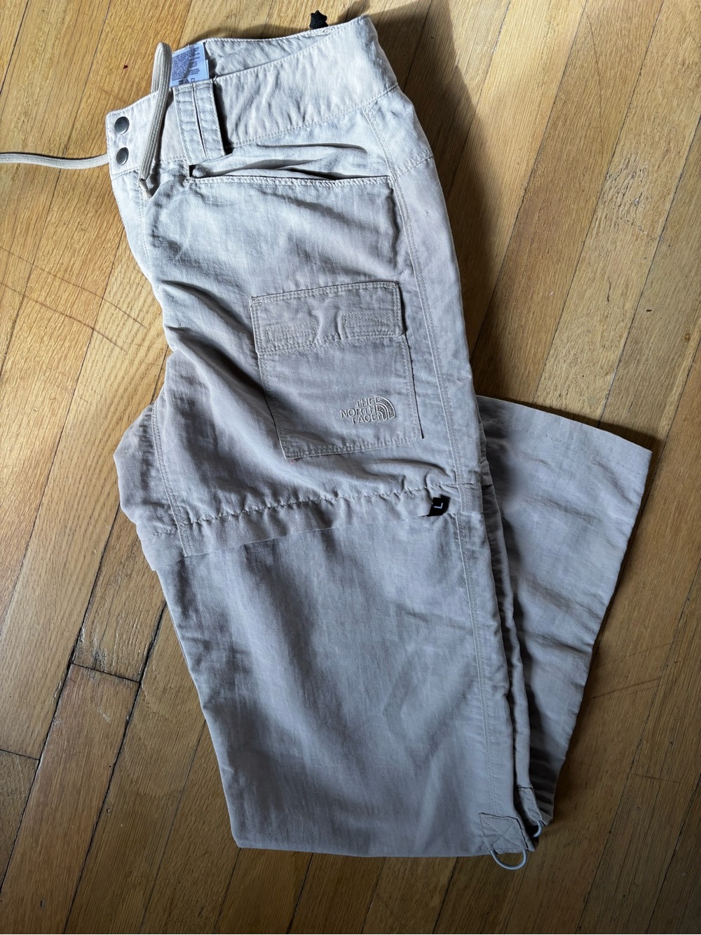 The North Face beige hiking convertible pants size 4